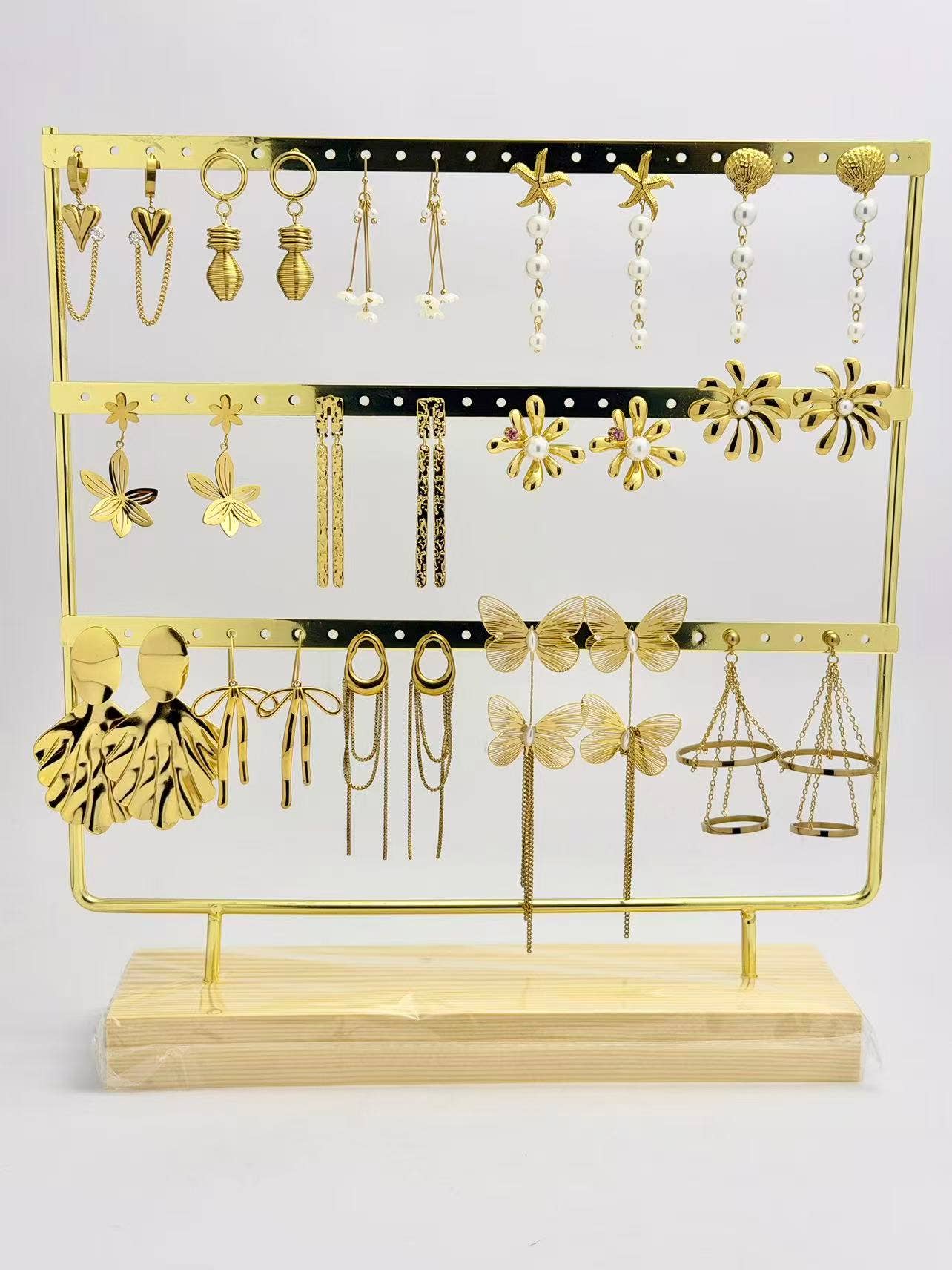 A hanging pair of refined, trendy, chic steel earrings