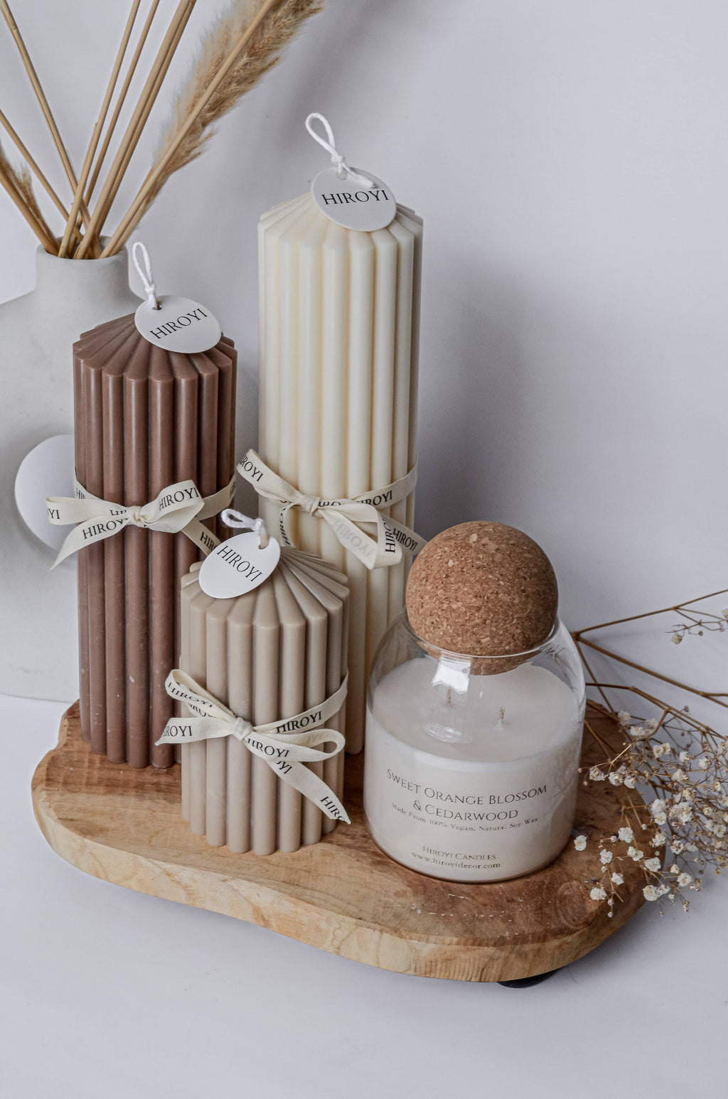 Designer scented candle in a glass jar with a ball‑shaped lid