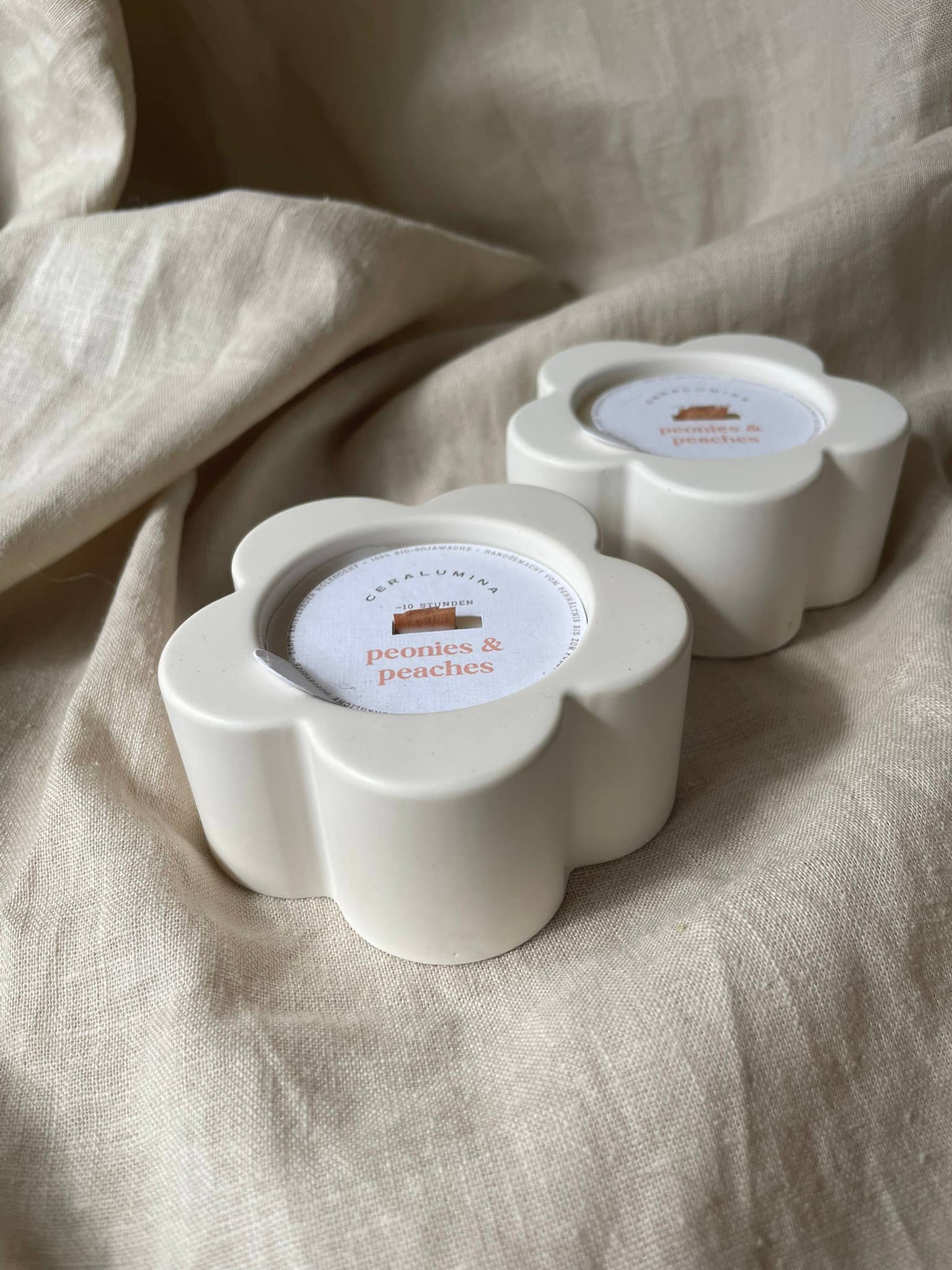 ‘Peonies & Peaches’ soy‑wax scented candle.