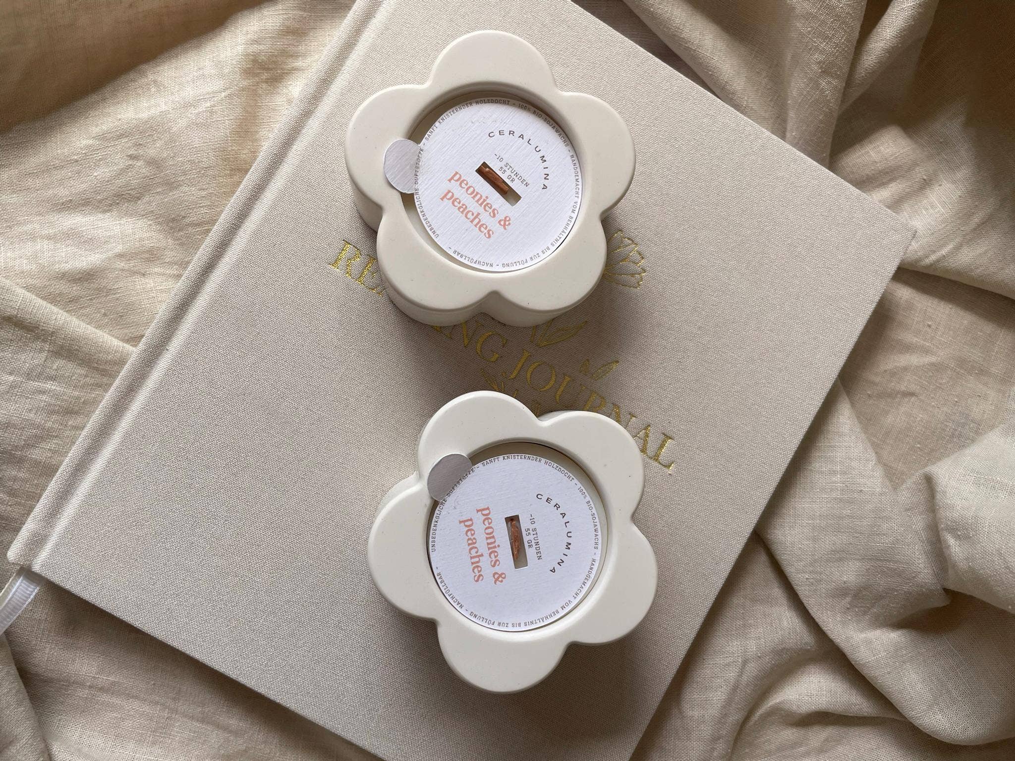 ‘Peonies & Peaches’ soy‑wax scented candle.
